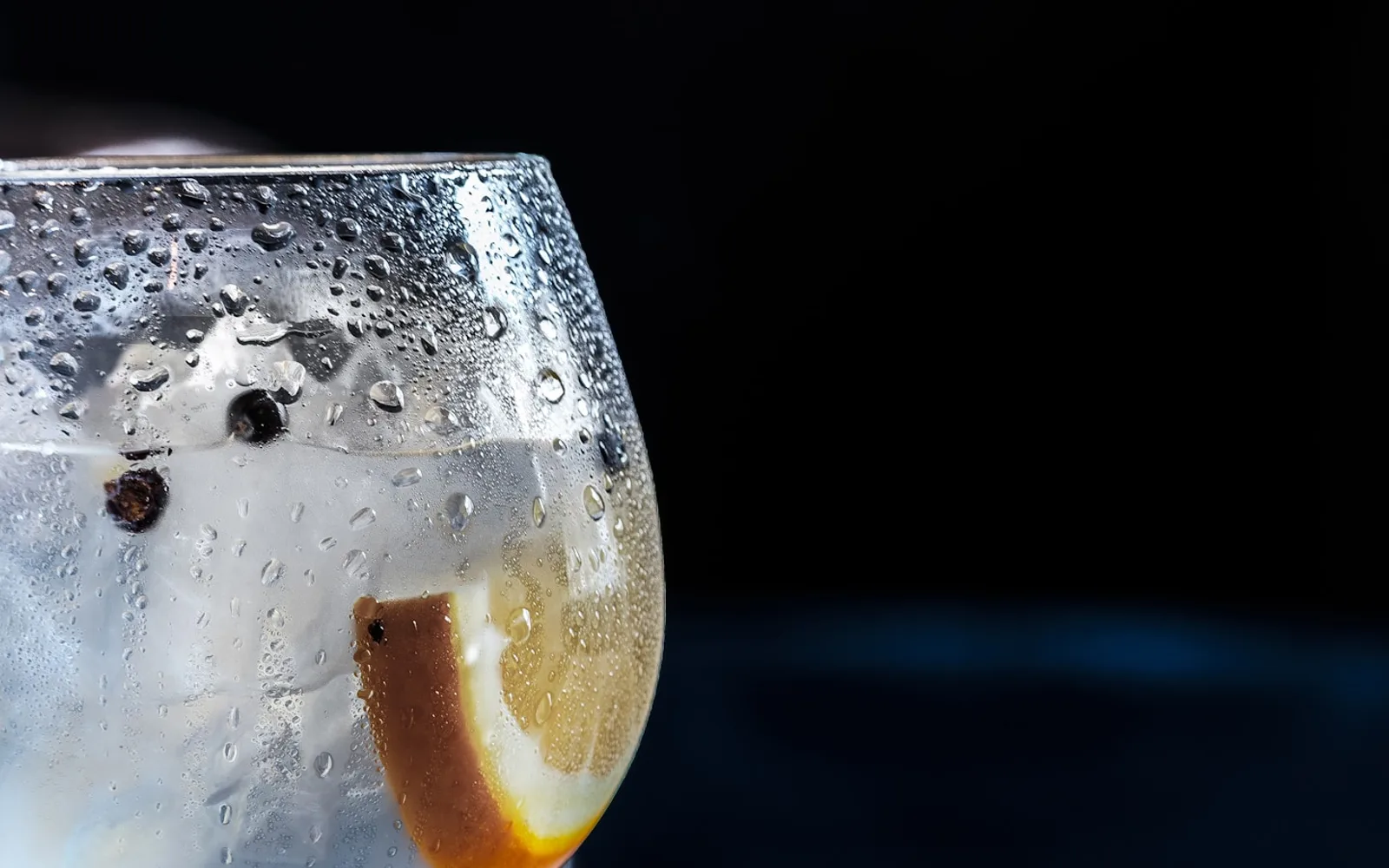 A chilled clear sparkling mocktail with citrus and ice